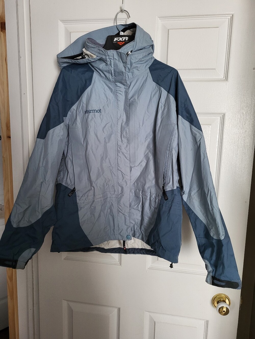 Marmot Women's Two-Tone Light and Dark Blue Rain Coat.